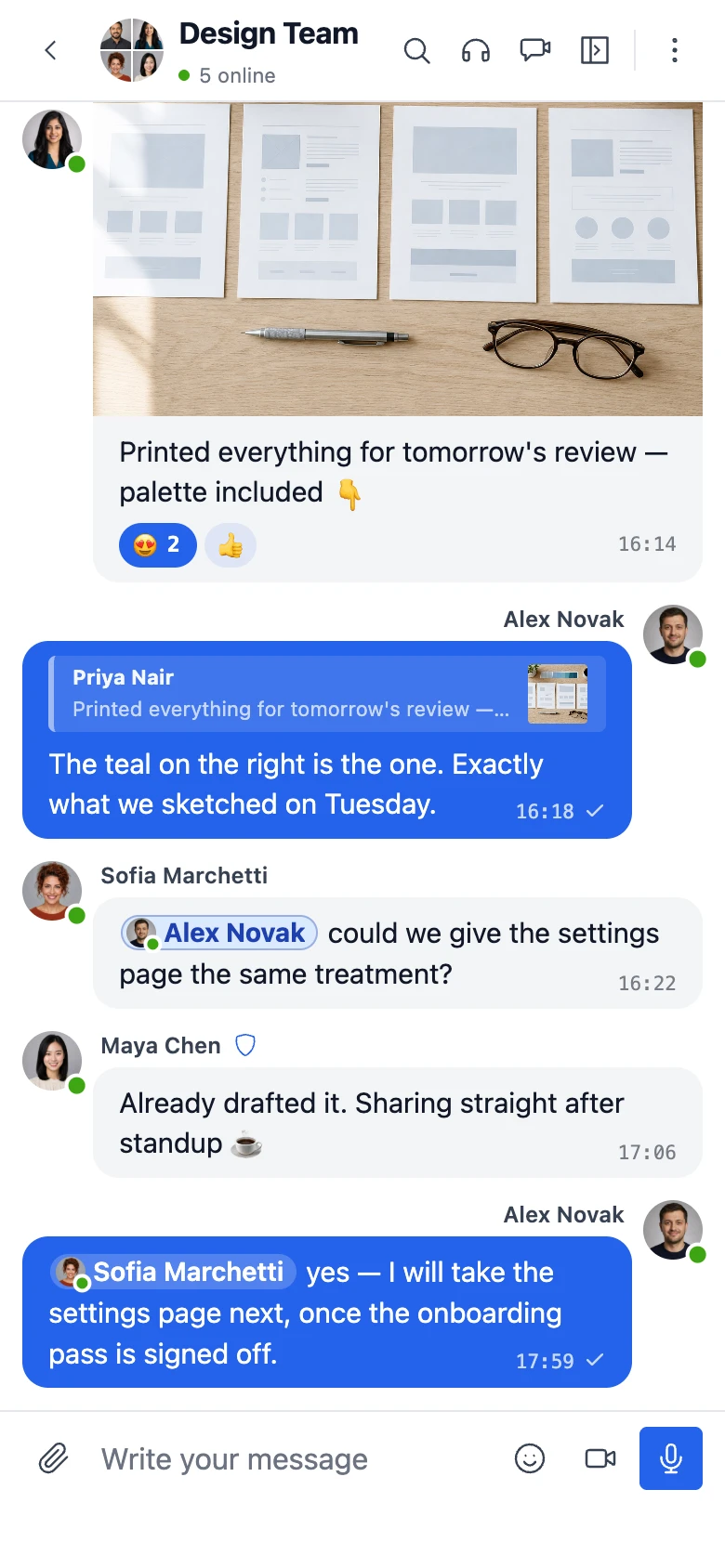 A group conversation on a phone, with a photo, reactions, a reply and mentions